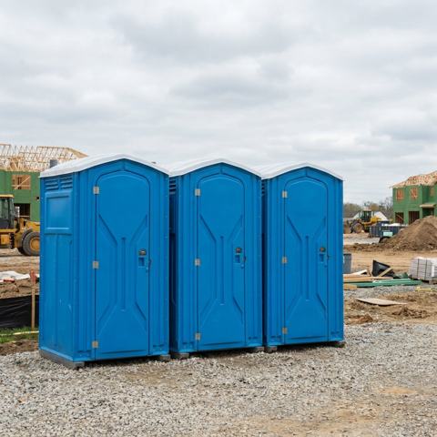 Standard porta potty rental units at a Houston, Texas construction site